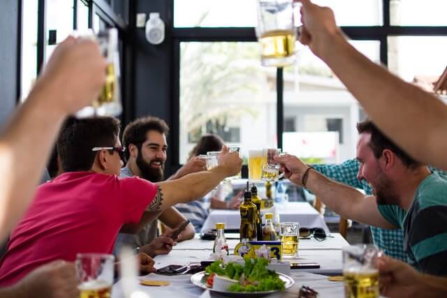 People sitting at a table having a drink